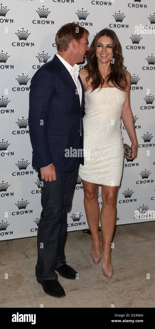 Shane Warne und Liz Hurley an der IMG Tennis Spieler Party, Krone, Melbourne, 13. Januar 2013. Stockfoto