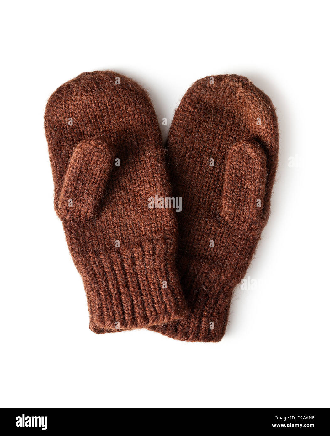 braune gestrickte Handschuhe auf weißem Hintergrund Stockfoto