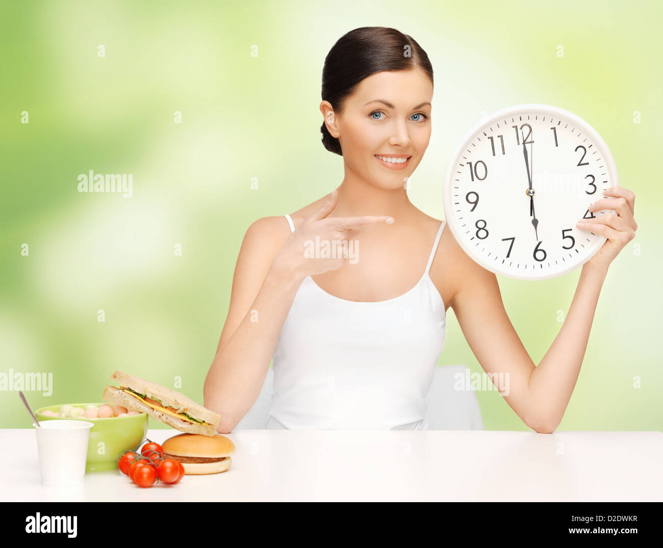 Frau mit grossen Uhr Stockfoto
