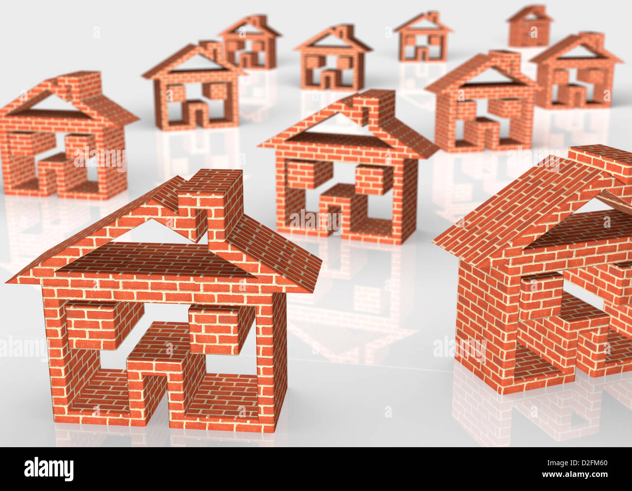 Ziegel-Haussymbole auf weißem Hintergrund - Wohnungsmarkt / Baukonzept Stockfoto