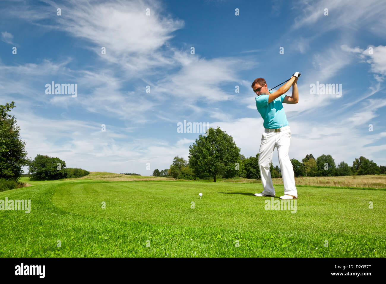 Ein Bild von einem jungen männlichen Golfspieler Stockfoto