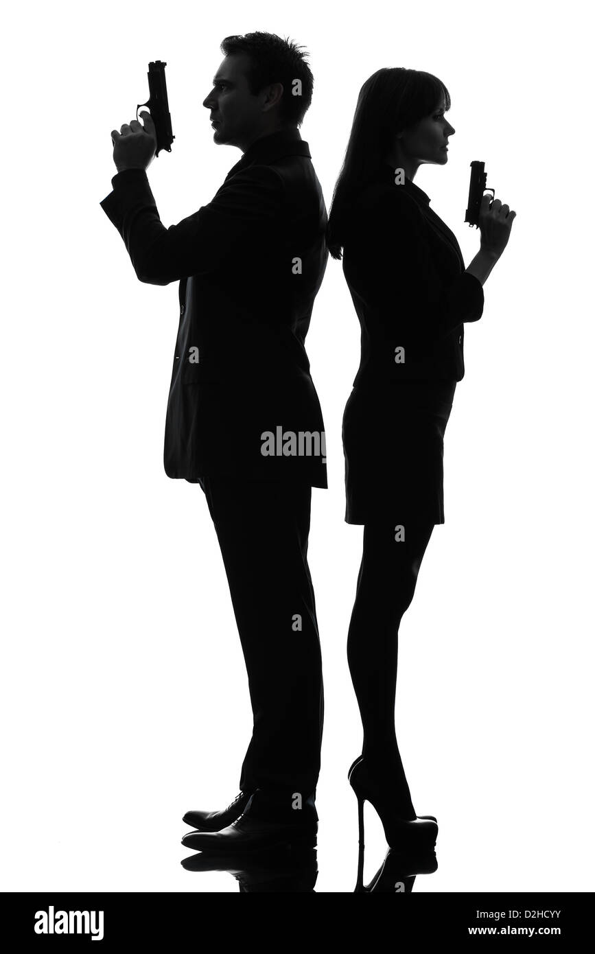 ein Mann Detektiv Geheimagent Verbrecher mit Pistole im Silhouette Studio isoliert auf weißem Hintergrund Stockfoto