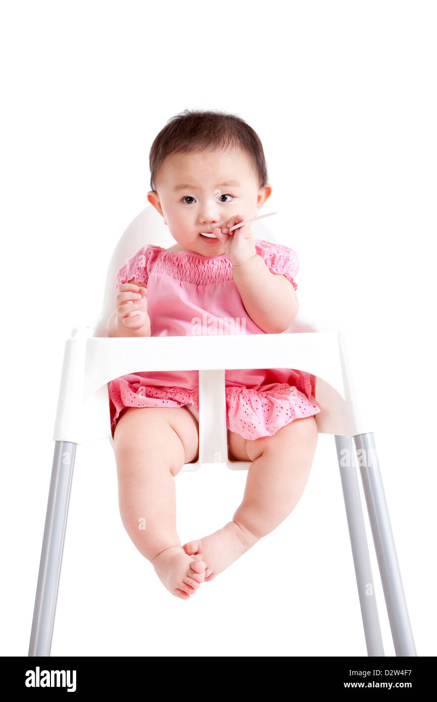Schöne Mädchen auf Baby Hochstuhl Stockfoto