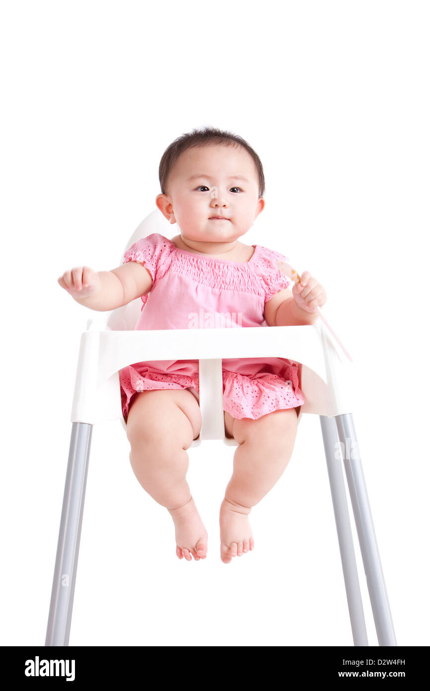 Schöne Mädchen auf Baby Hochstuhl Stockfoto