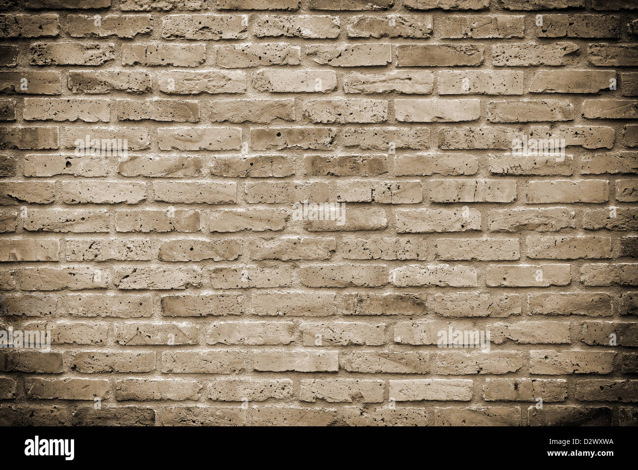 Mauer aus alten Ziegeln in sepia Stockfoto