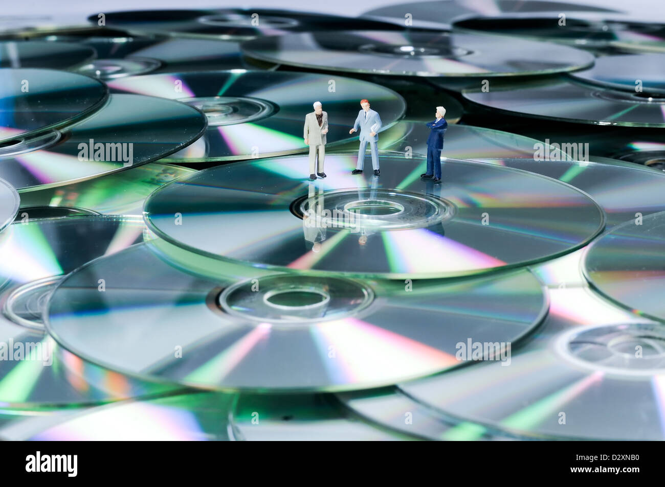 Unternehmer Zahlen auf DVDs Stockfoto