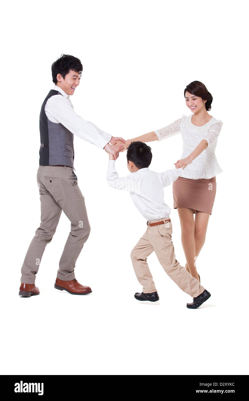 Glückliche junge Familie drehen im Kreis, hand Stockfoto