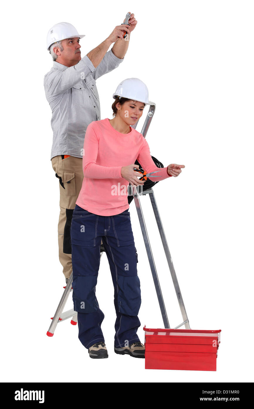 Elektriker und weiblichen Lehrling Stockfoto