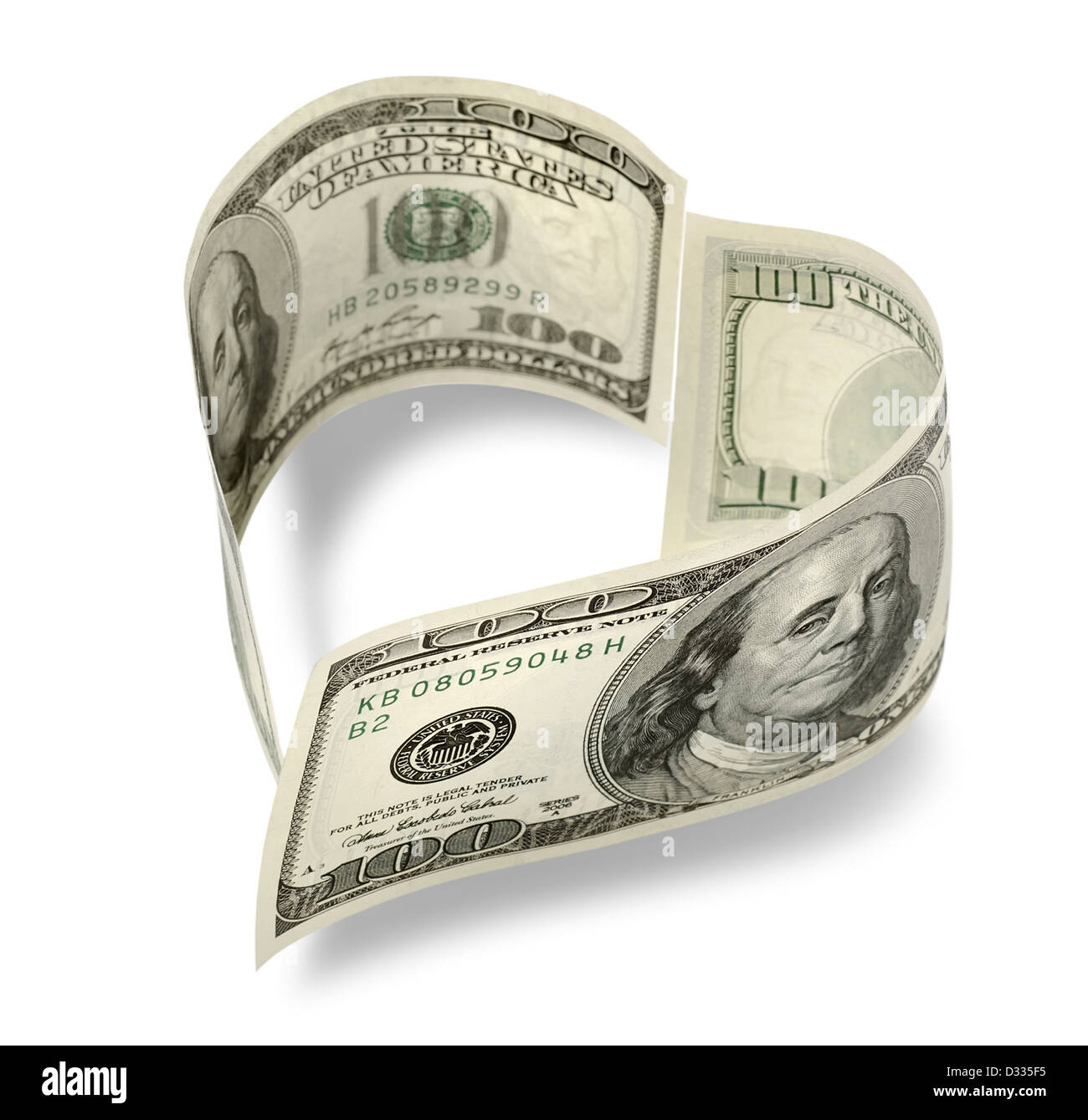 Herzförmige Geld isoliert auf weißem Hintergrund Stockfoto