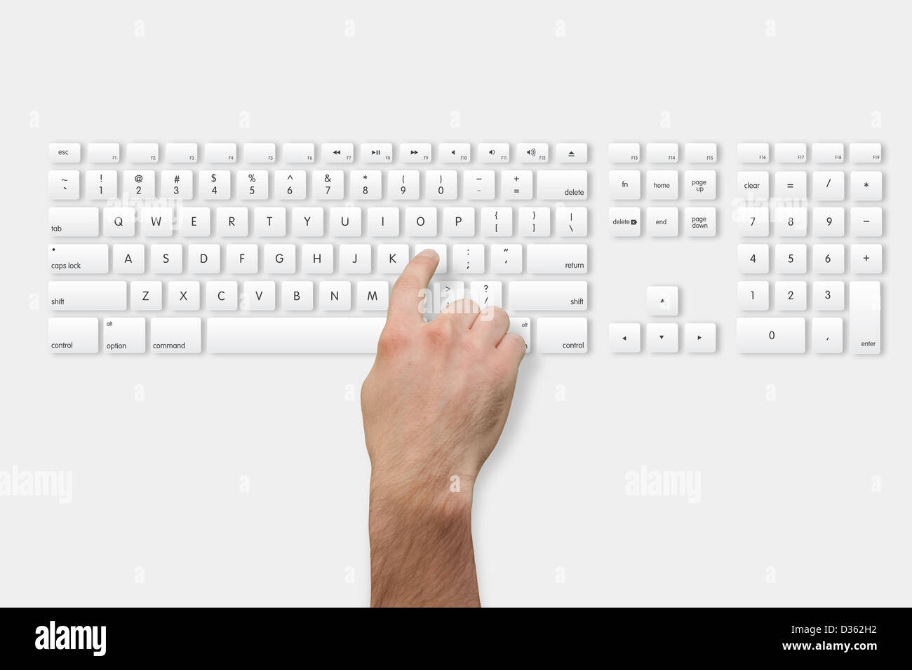 Hand, die l-Taste auf der Tastatur Stockfoto