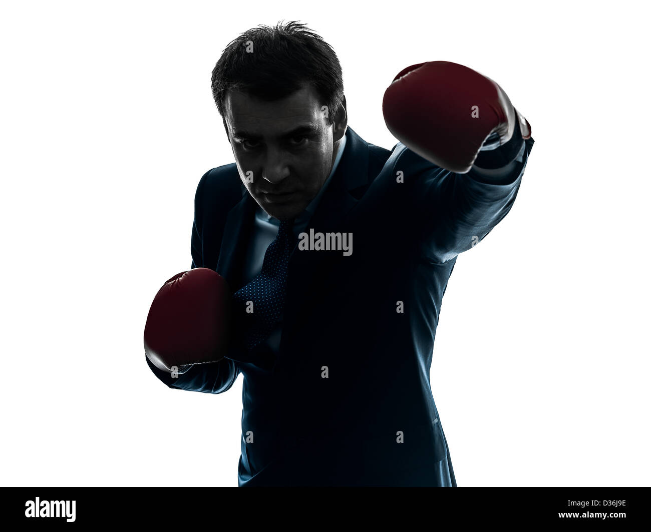 ein Geschäftsmann mit Boxhandschuhen Silhouette Studio isoliert auf weißem Hintergrund Stockfoto