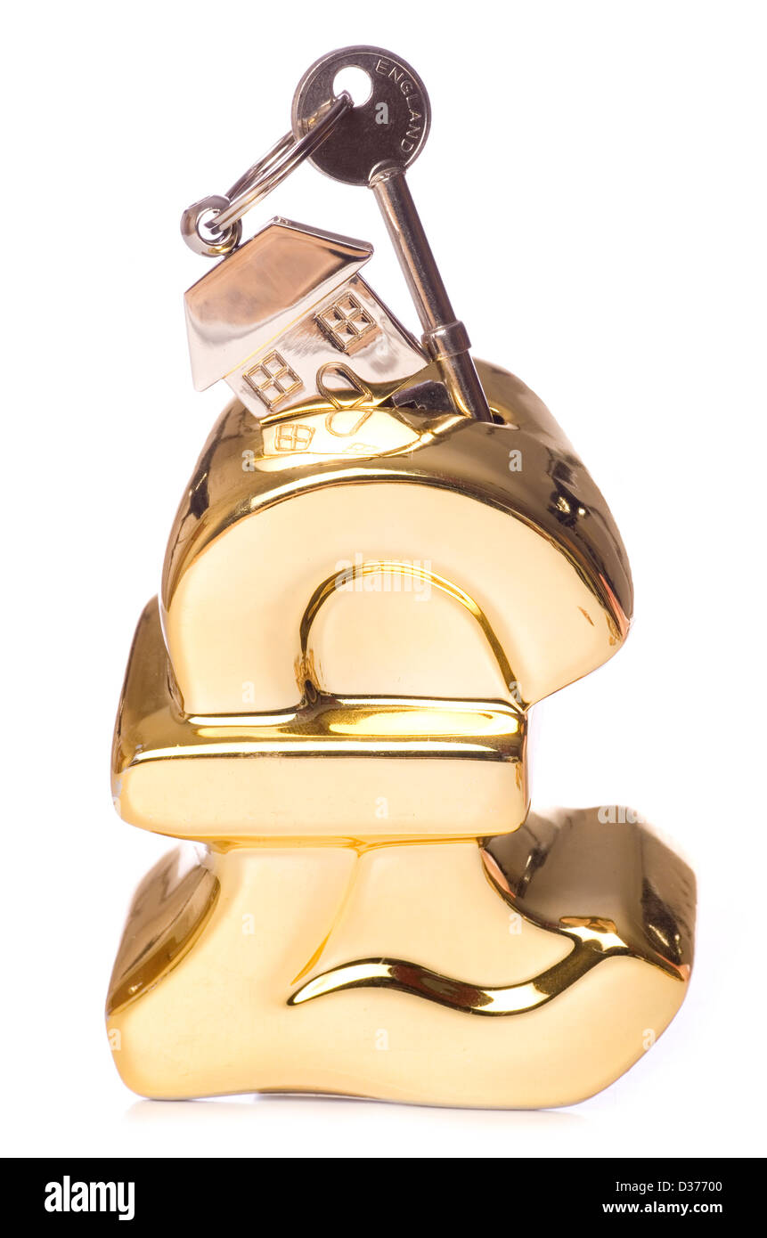 Sparschwein mit Schlüssel und Schlüsselanhänger Studio Ausschnitt Stockfoto