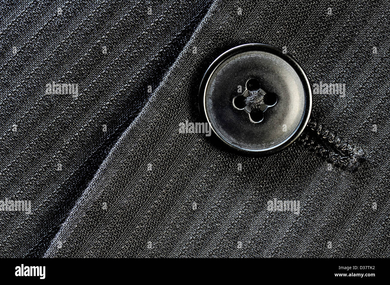 Detail der Nahaufnahme von Anzug-Taste am Stift ausgezogen Tuch Stockfoto