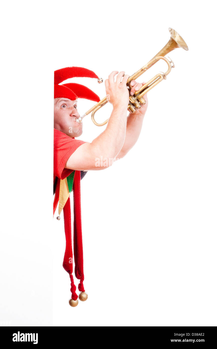 Jester - Figur in der typischen Tracht Trompete bläst unterhaltsam Stockfoto