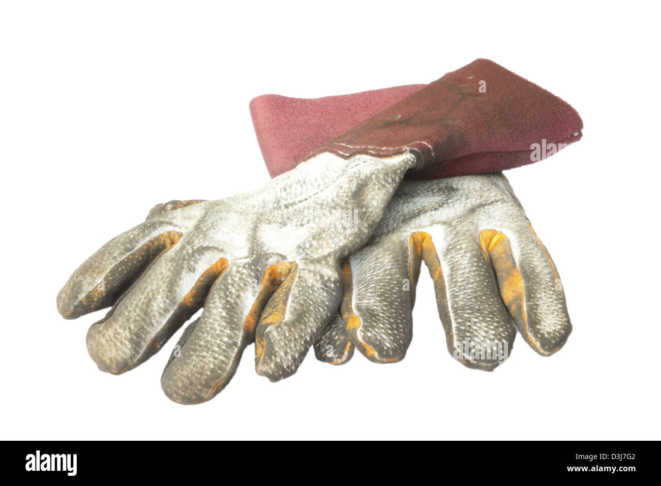 Schmutzige alte Lederhandschuhe isoliert auf weißem Hintergrund Stockfoto