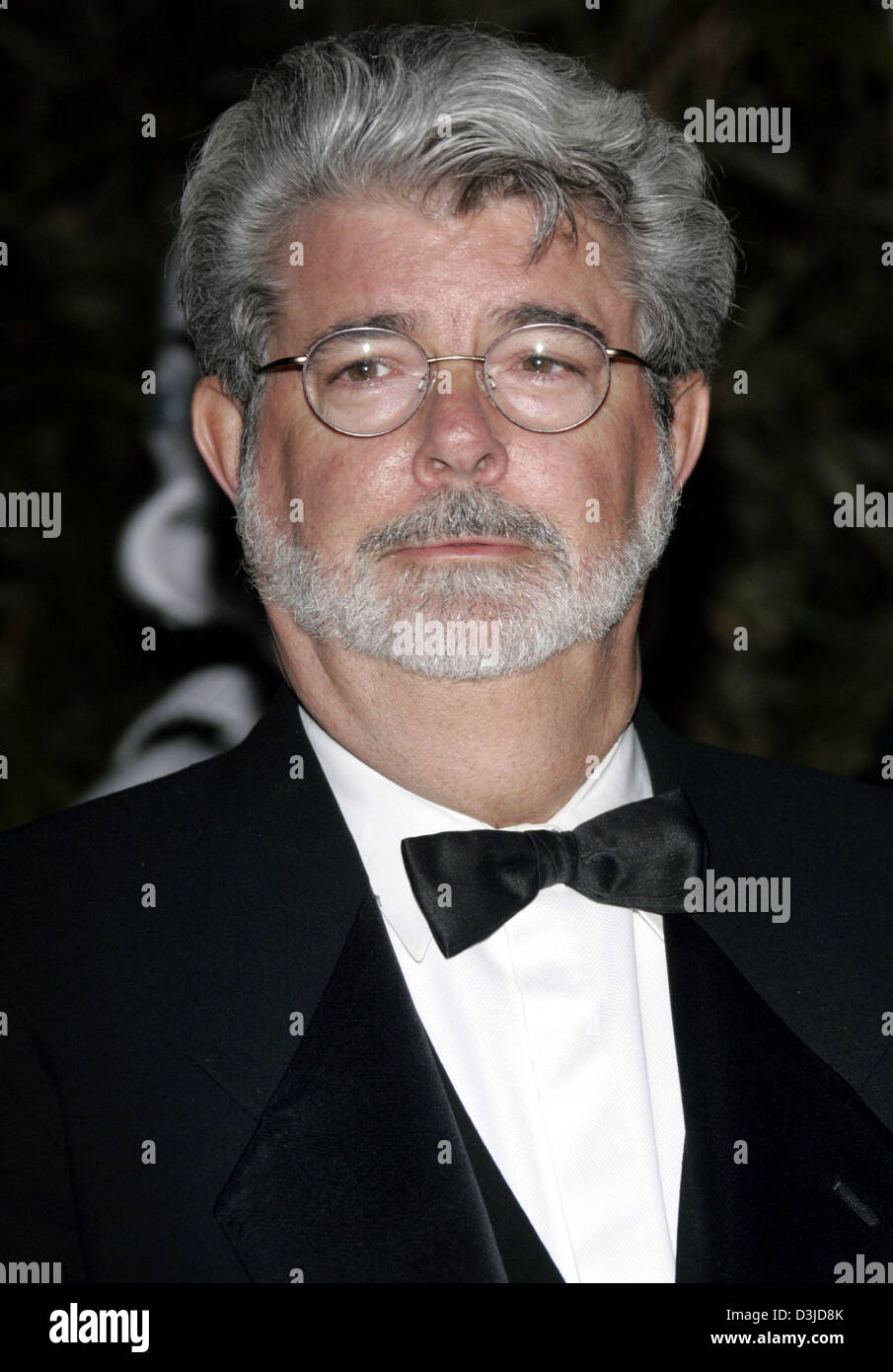 (Dpa) - kommt Regisseur George Lucas auf einer Party anlässlich der Premiere des Films "Star Wars Episode 3 - die Rache der Sith" bei den 58. Internationalen Filmfestspielen in Cannes, Frankreich, 15. Mai 2005. Stockfoto