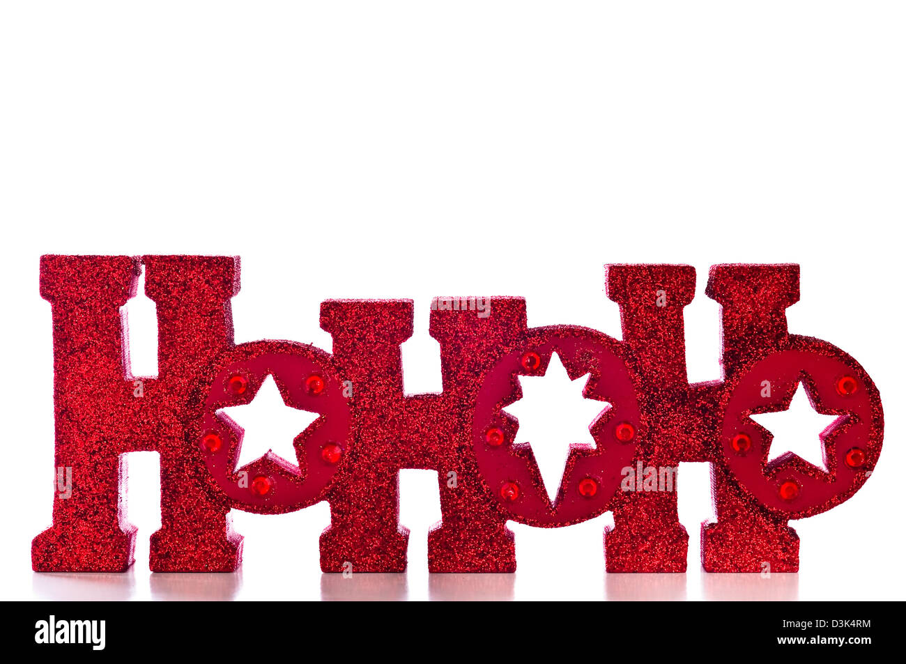 Wort buchstabiert HoHoHo in roten glitzernden Buchstaben; isoliert auf weißem Hintergrund. Stockfoto