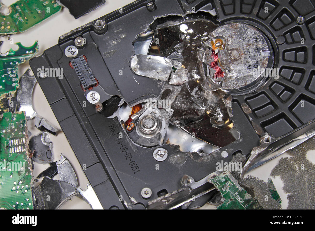 Close up detail showing a deliberately smashed up personal computer hard drive. Stockfoto