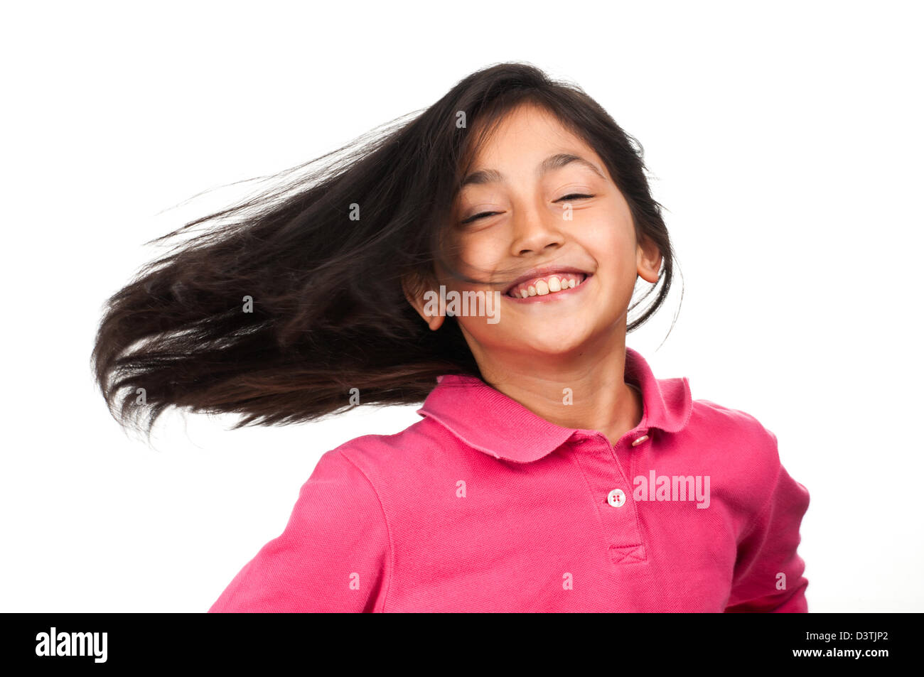 Das glückliche kleine Mädchen auf weißem Hintergrund Stockfoto