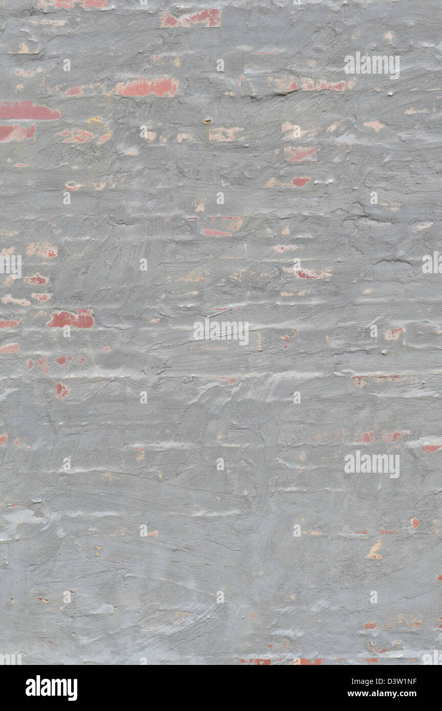 Mauer aus Backstein und grau Stuck, in der Nähe von groben Sandstrand ungleichmäßige wirbelte Finish, Gestaltungselement für Hintergründe, Texturen Stockfoto
