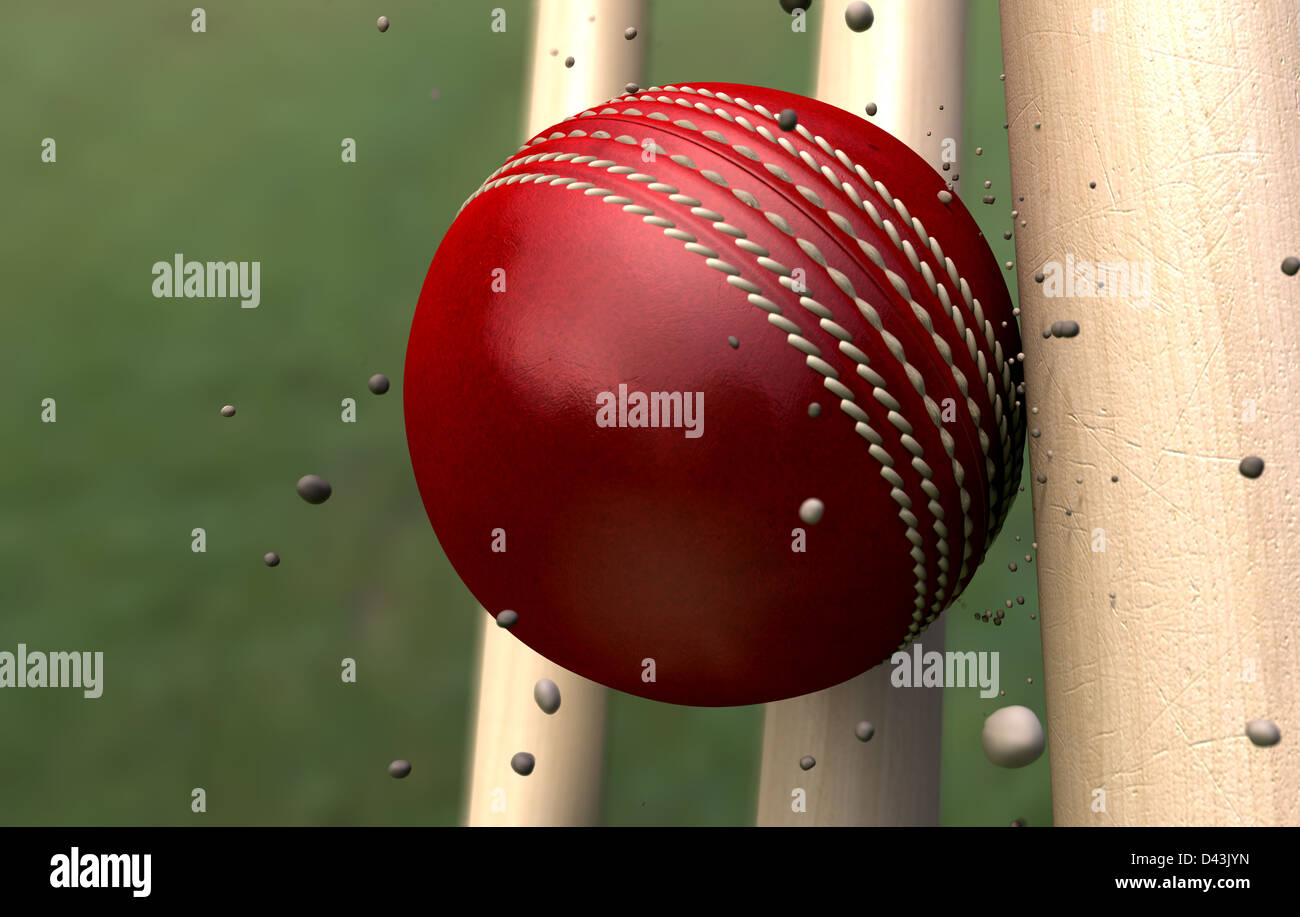 Ein rotes Leder genäht Cricketball Kollision mit hölzernen Pforten mit Schmutzpartikeln aus der Auswirkungen Stockfoto