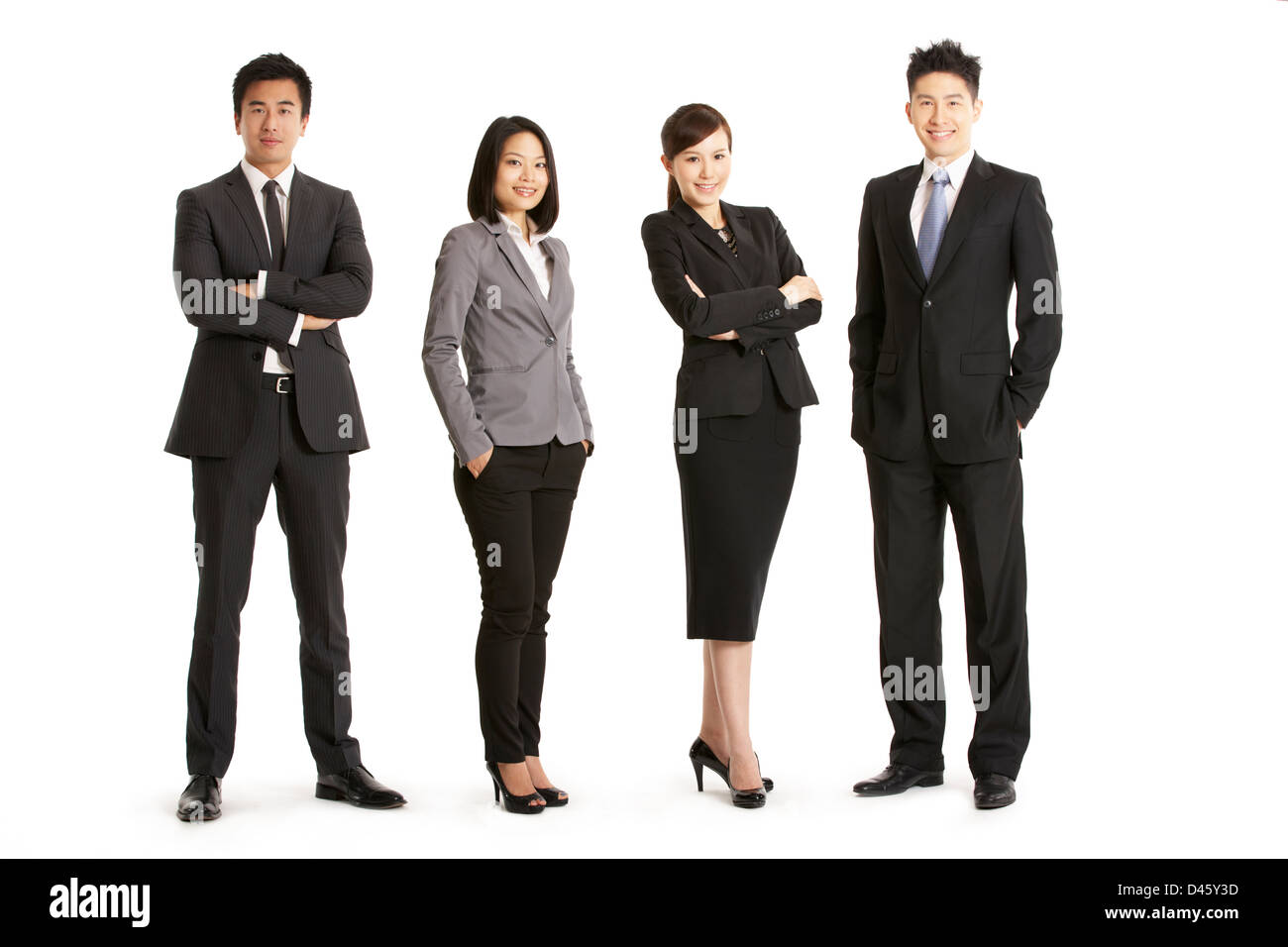Full Length Studioportrait Of Chinese Business Team Stockfoto