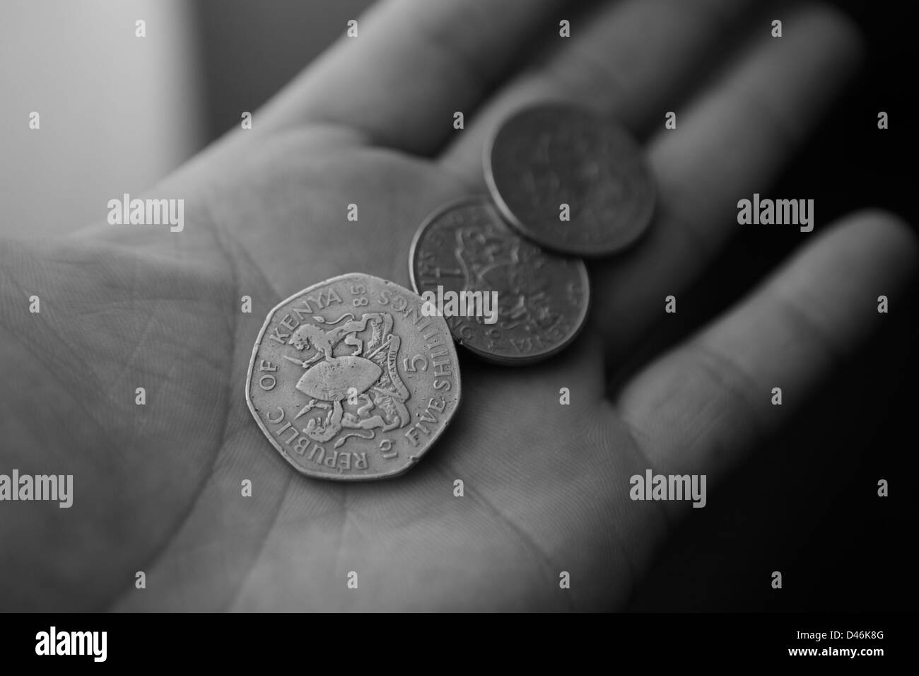 Münzen in der hand Stockfoto