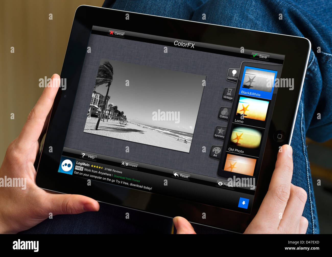 Bearbeiten ein Foto mit der kostenlosen app von Fotolr HD auf eine 4. Generation Apple iPad, USA Stockfoto