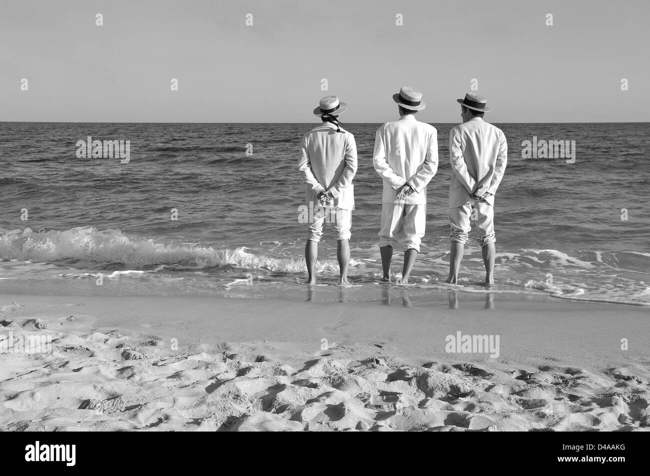 Drei Herren am Strand Stockfoto