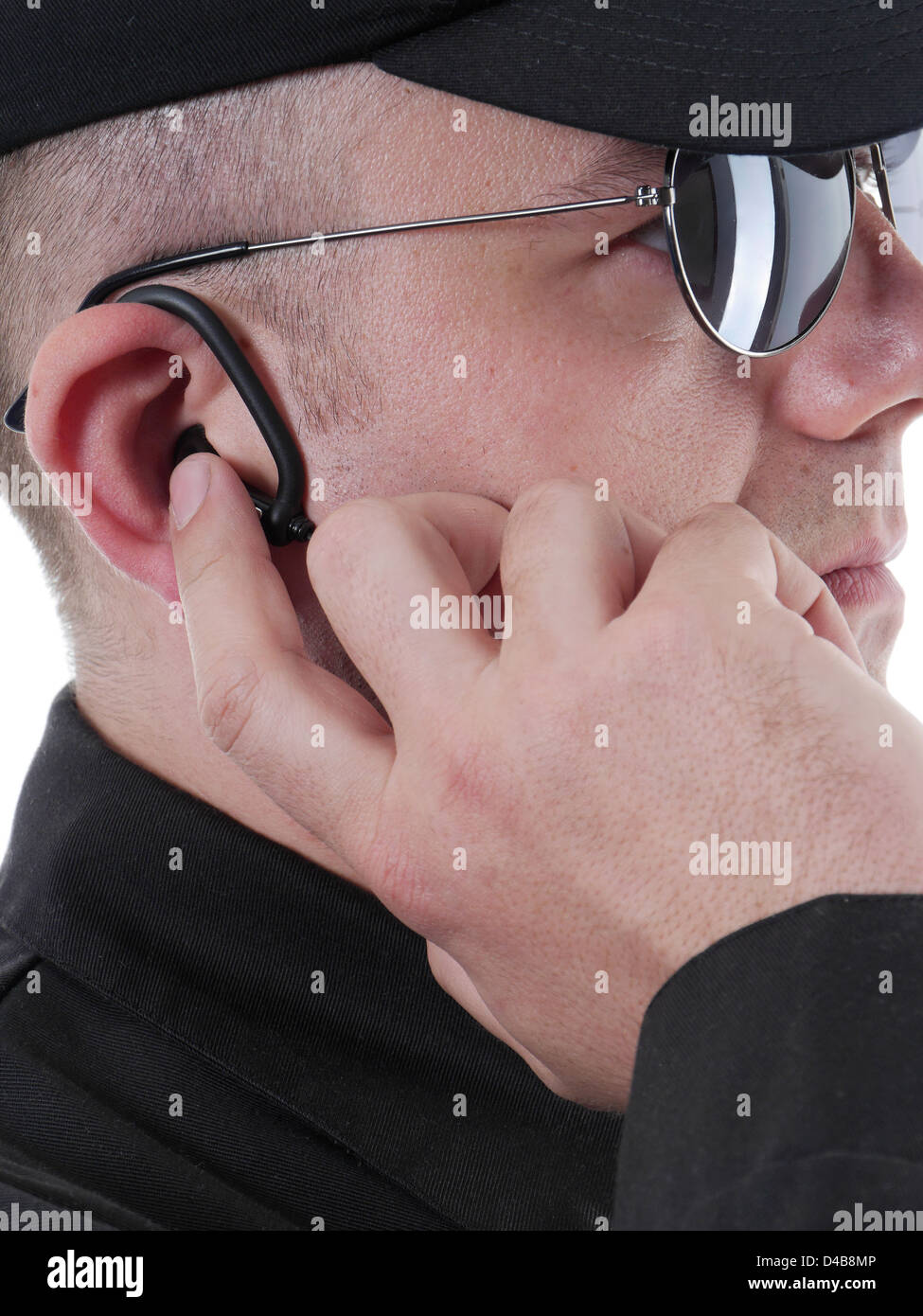 Nahaufnahme des Geheimdienstes Mann mit Kopfhörer für Kommunikation Stockfoto