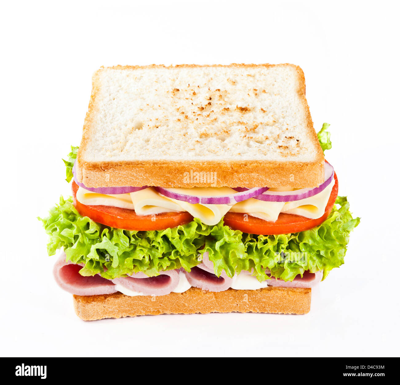 Sandwich mit Schinken, Käse, Tomaten, Zwiebeln und Salat. Stockfoto