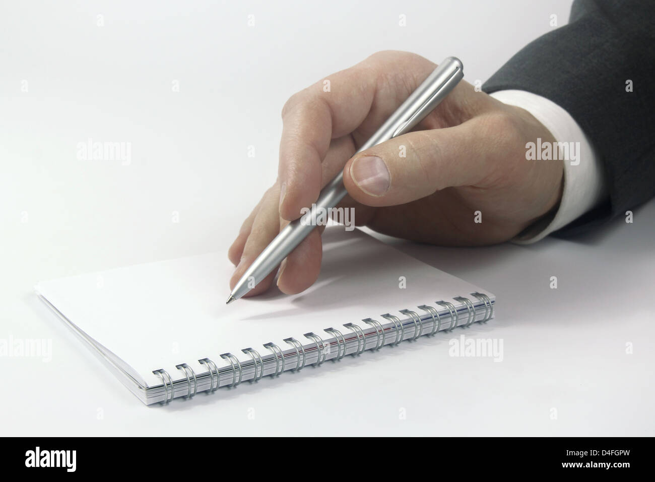Unternehmen der Hand mit Stift über notebook Stockfoto