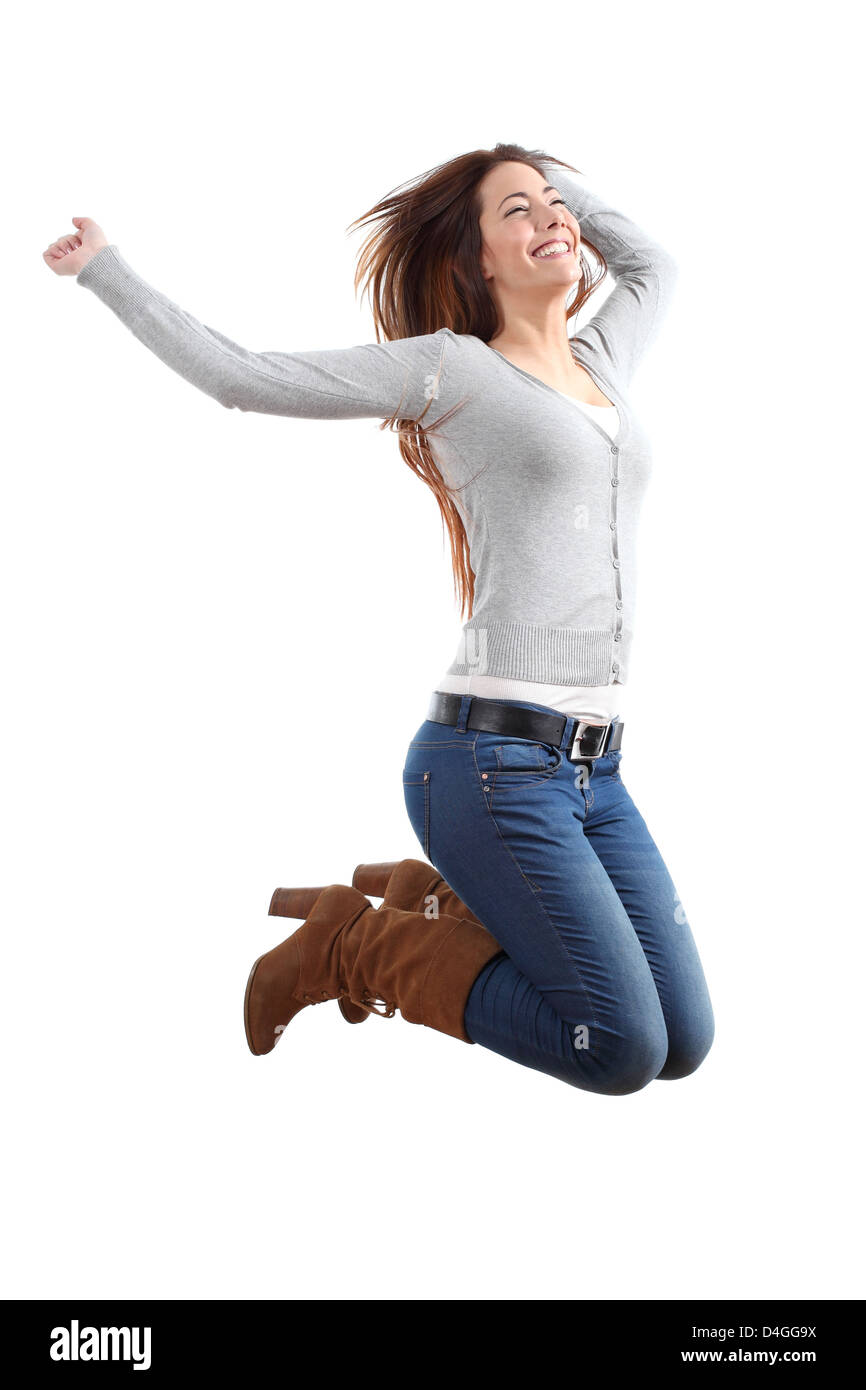 Hübsche Teen springen glücklich mit ihren Armen angehoben auf einem weißen Hintergrund isoliert Stockfoto