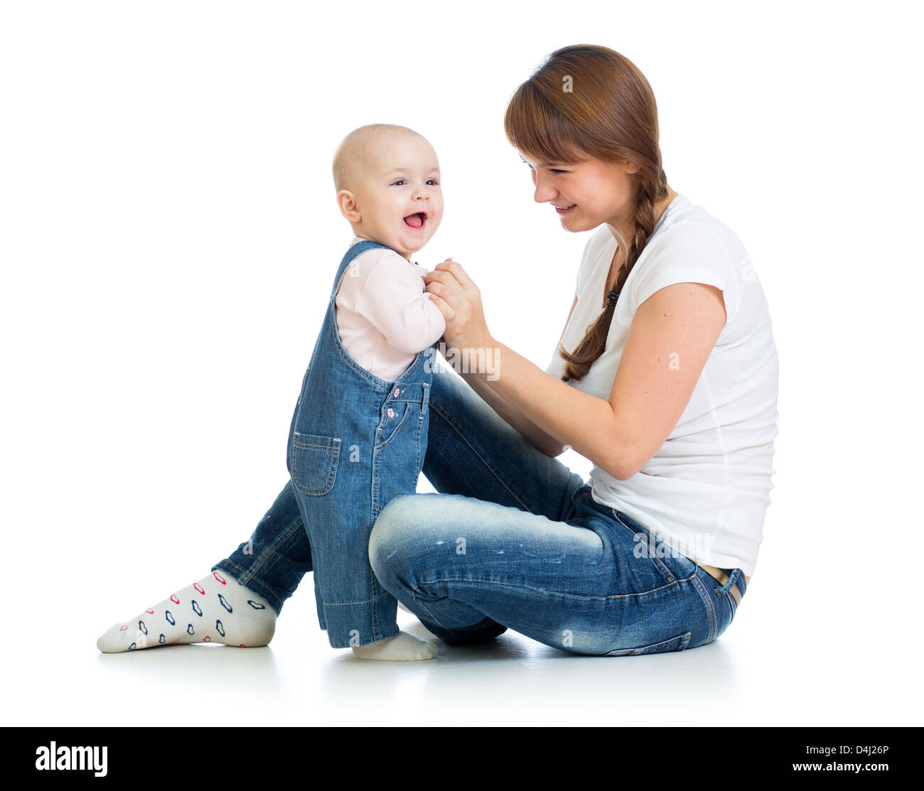 Liebevolle Mutter mit ihrem Baby Girl Spielen Stockfoto