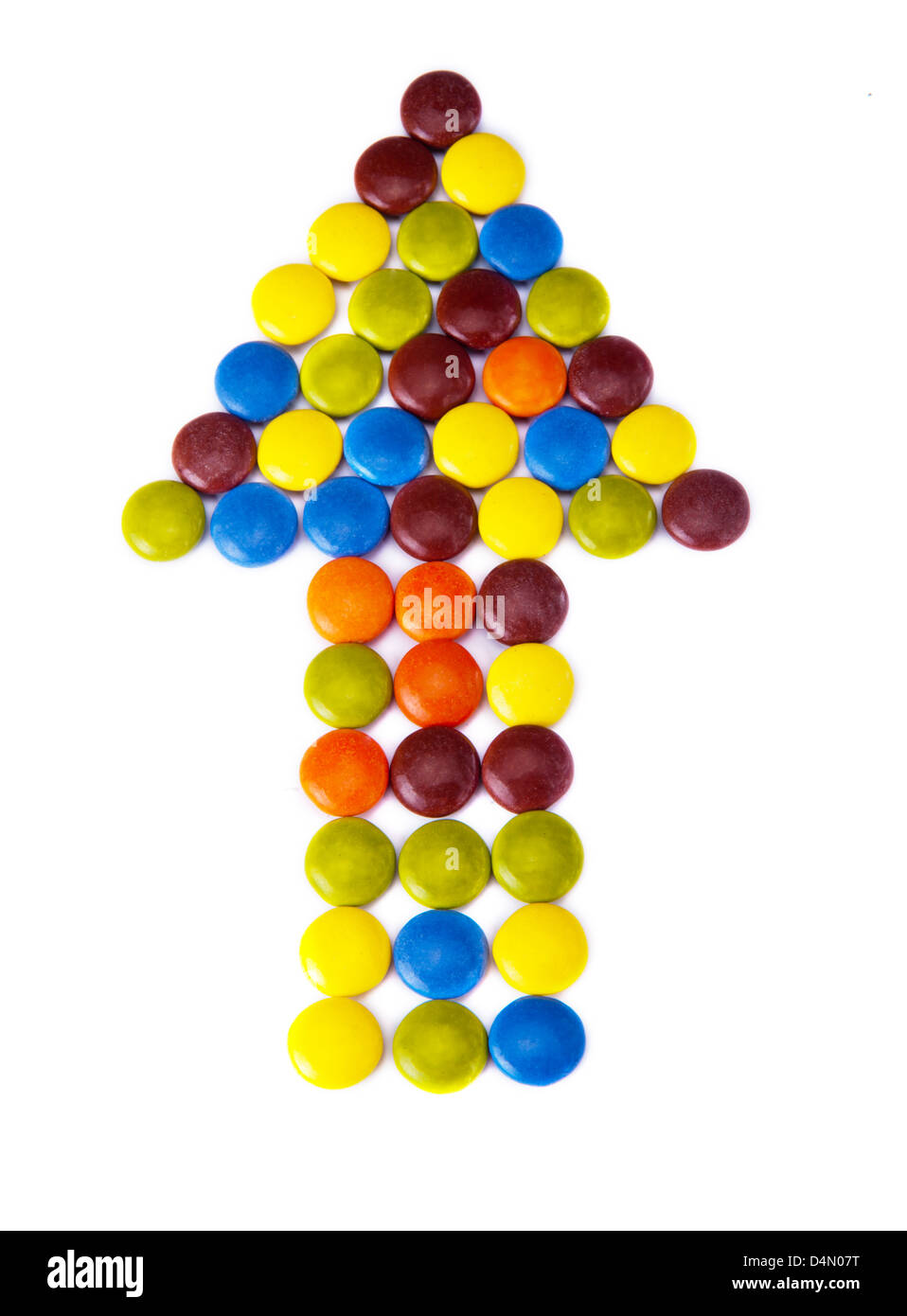 Pfeil der bunten Süßigkeiten isoliert auf weißem Hintergrund Stockfoto