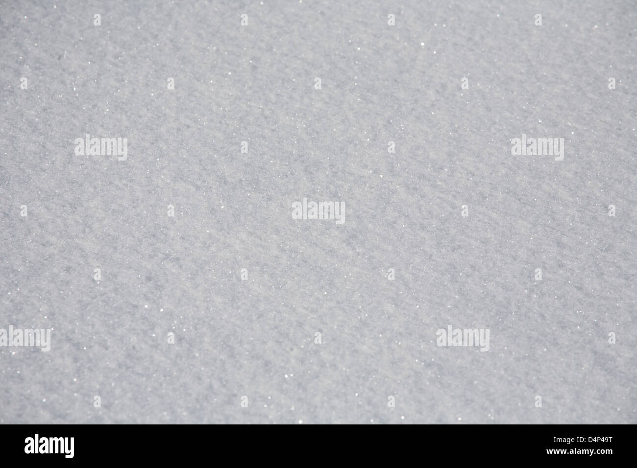 Muster auf Schnee Oberfläche Strahlen auf der Sonne Licht closeup Stockfoto