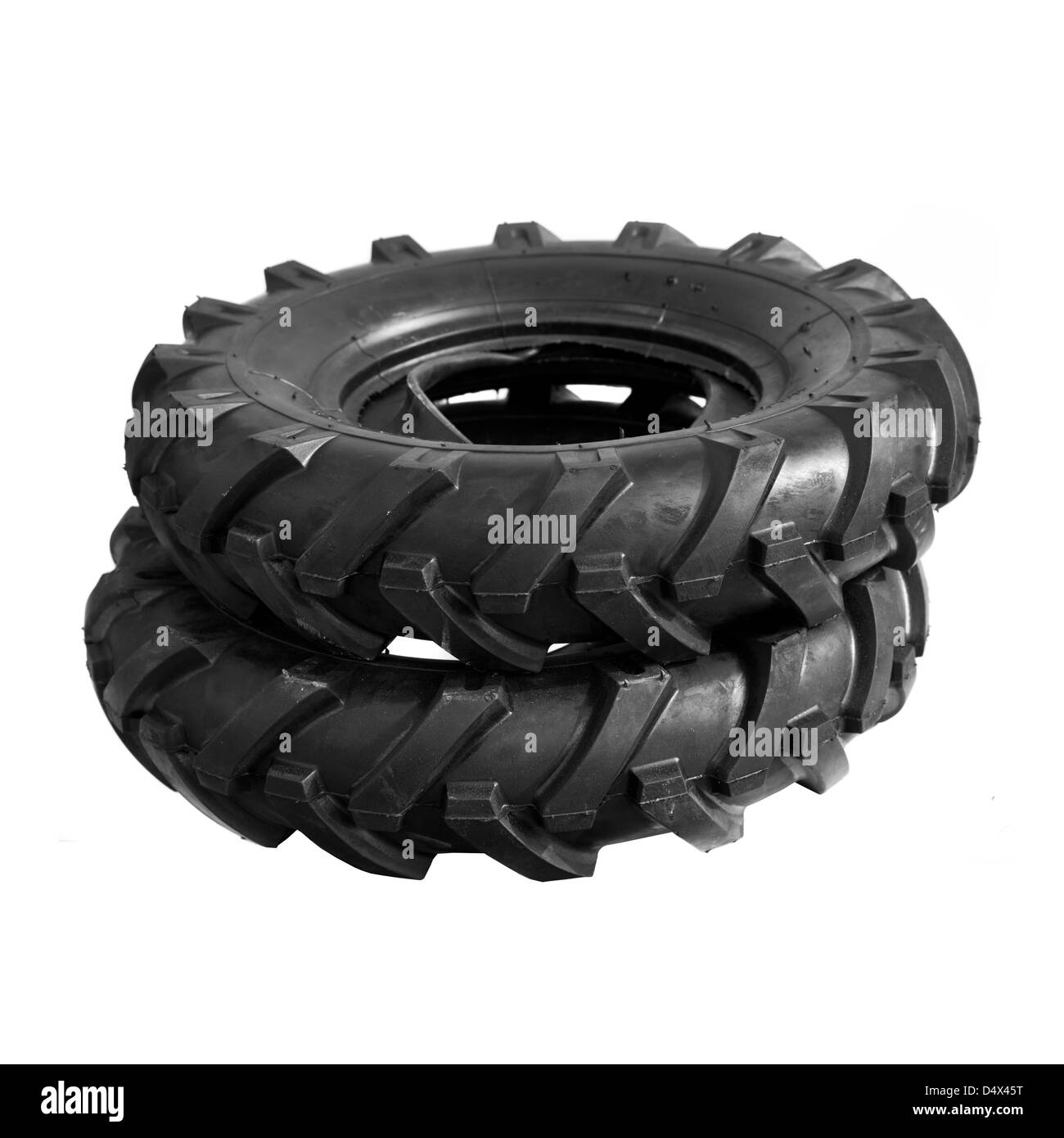 Neue, unbenutzte schwarze Grubber Reifen. Landwirtschaft und Landwirtschaft Hintergrundbild. Stockfoto