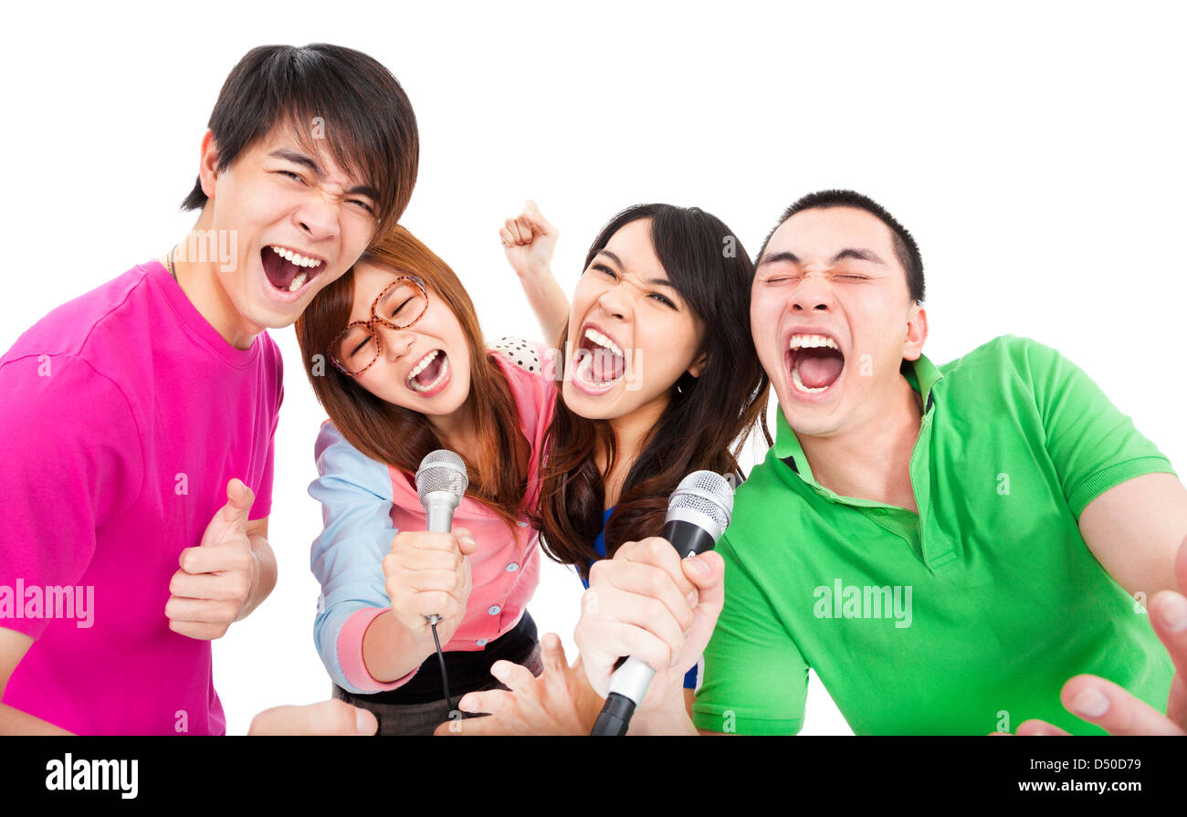 glückliche junge Gruppe Spaß mit Karaoke singen Stockfoto