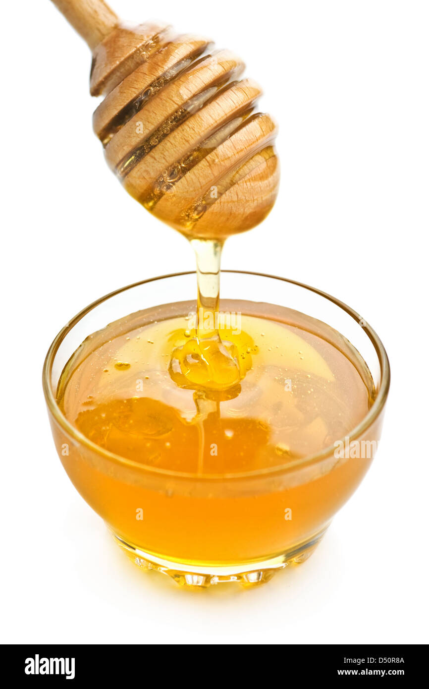 flüssigen Honig in Holz Löffel Stockfoto