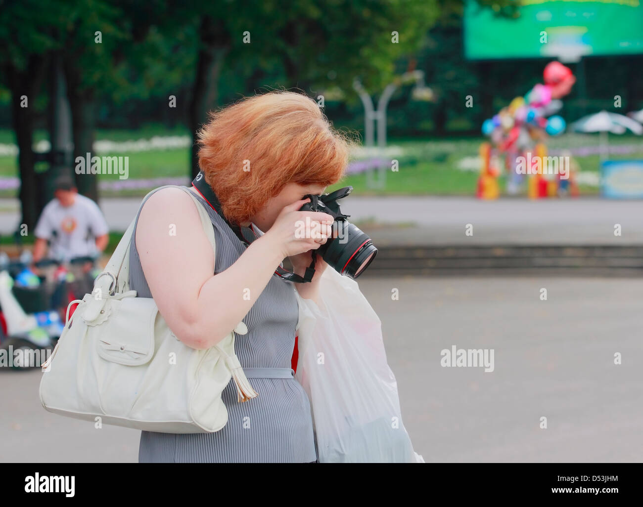 die Frau-ein Fotograf fotografiert Stockfoto