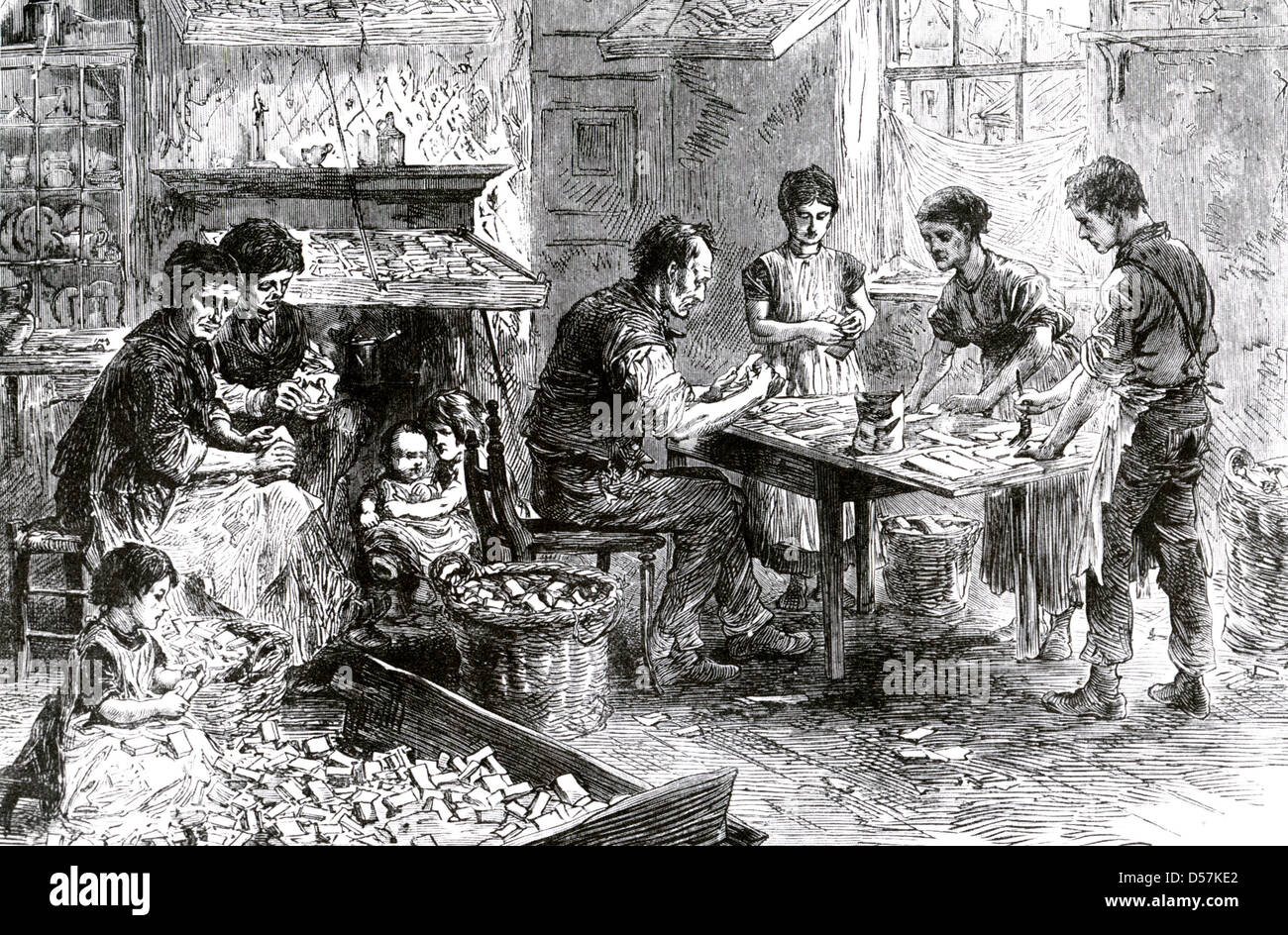 VIKTORIANISCHE SWEATSHOP. Familie Streichholzschachteln in Bow, London, im Jahre 1871. Stockfoto