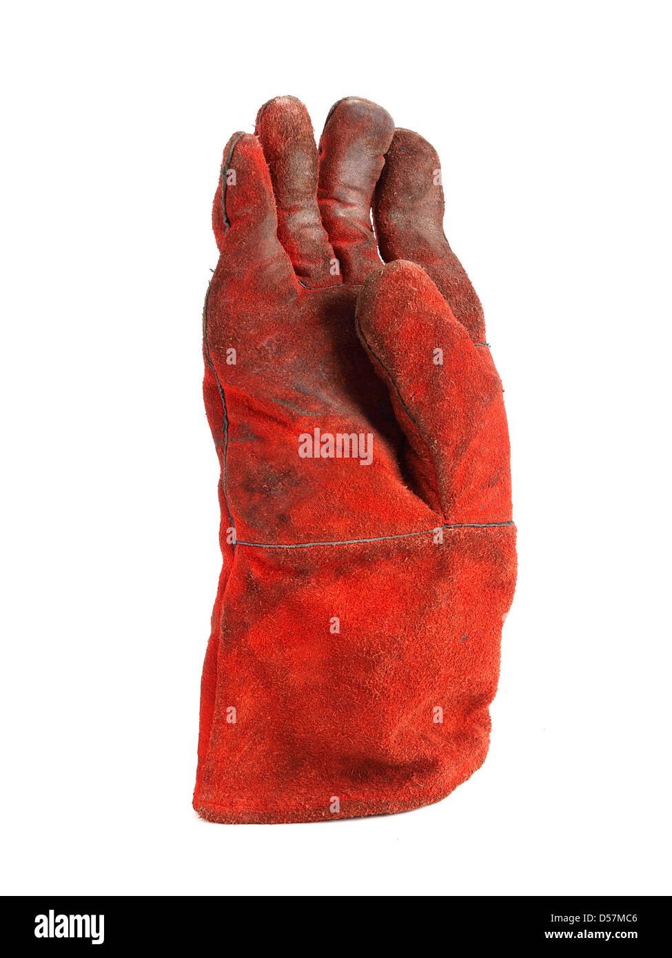 Einen roten Handschuh auf weißem Hintergrund. Der Handschuh ist eine Schutzkleidung. Stockfoto
