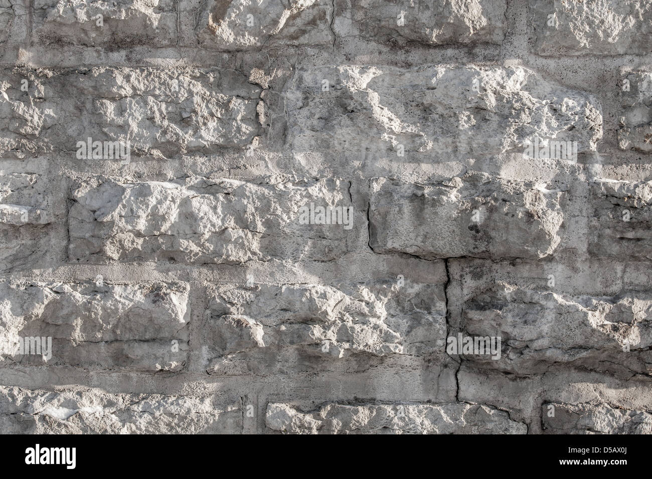 Textur von einer groben Steinmauer gemacht mit Blöcken Stockfoto