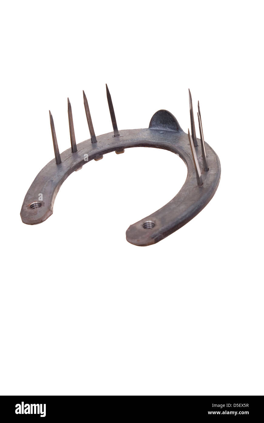 neue Hufeisen mit Nägeln auf weißem Hintergrund Stockfoto