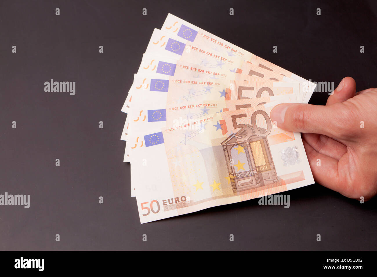 Hand mit Euro Stockfoto