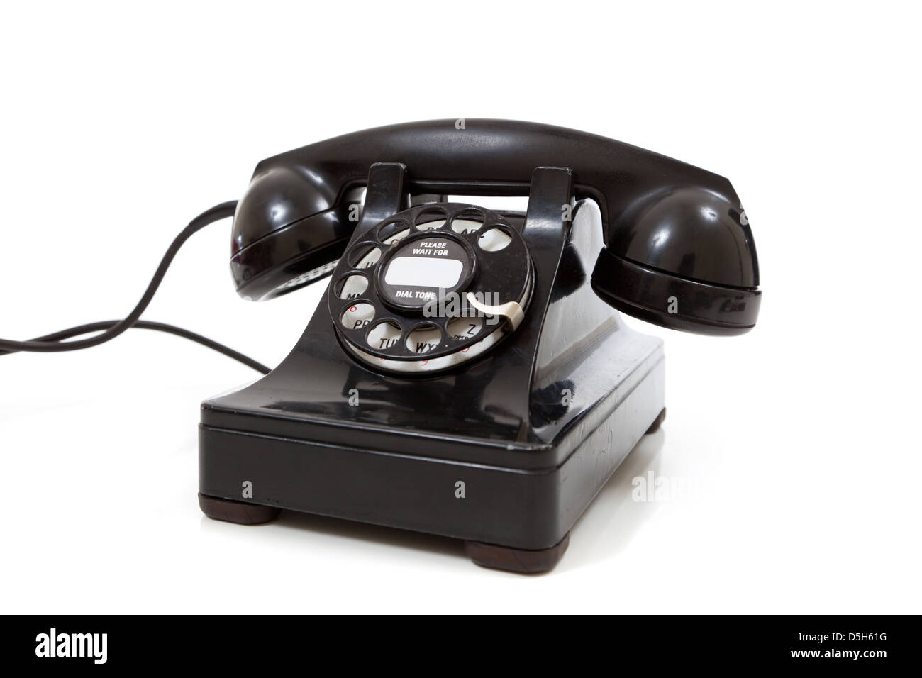 Eine schwarze Vintage Telefon mit Wählscheibe auf weißem Hintergrund Stockfoto