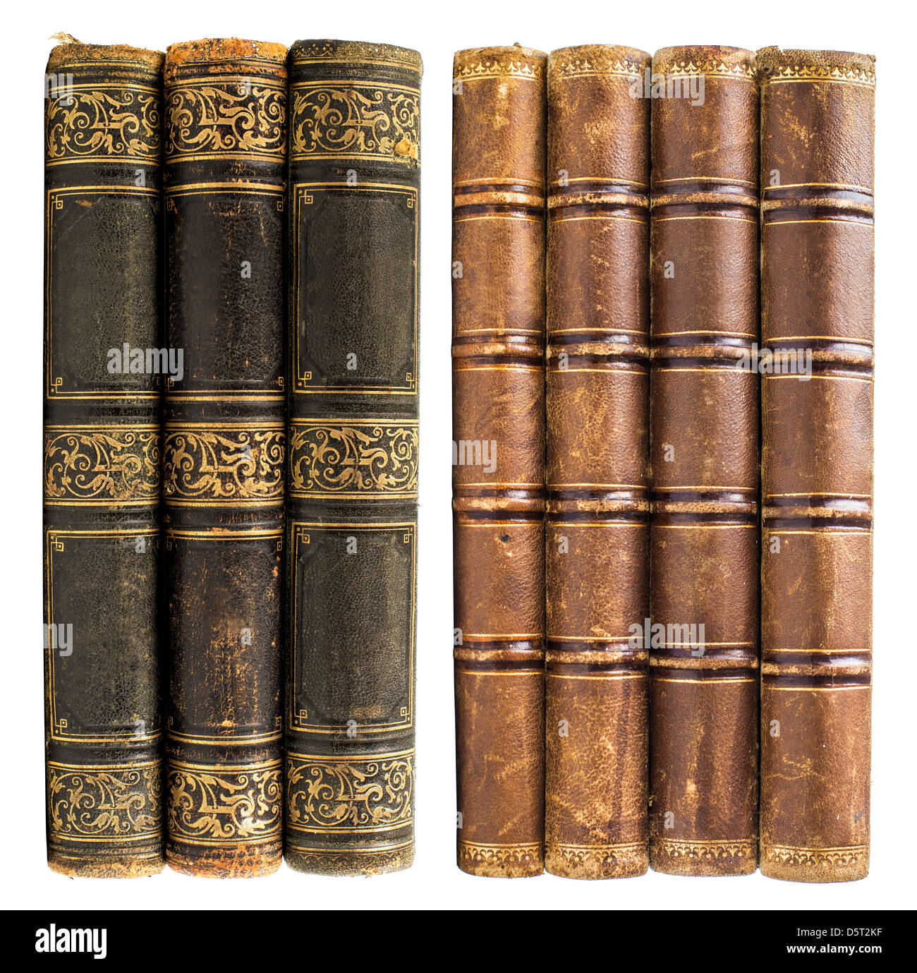 schwarze und braune alte Bücher mit goldenen Design isoliert auf weiss Stockfoto