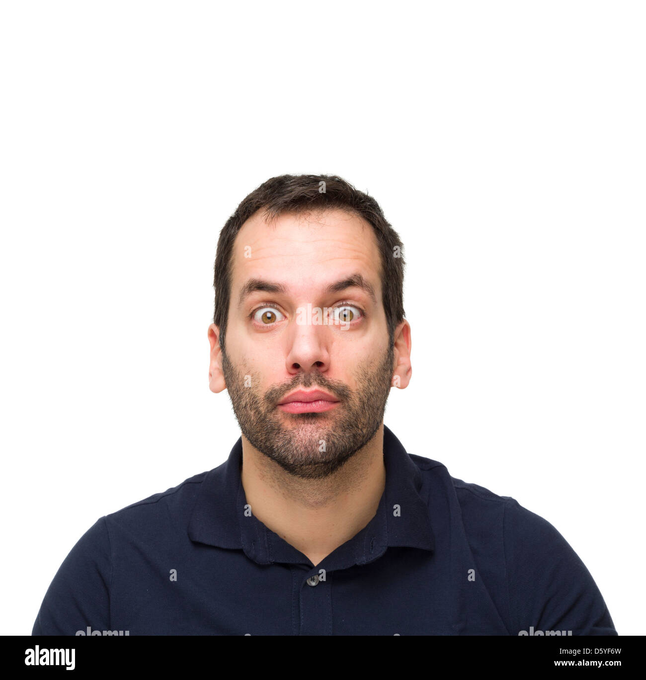 Porträt eines jungen Mannes mit Bart, Blick in die Kamera überrascht Stockfoto