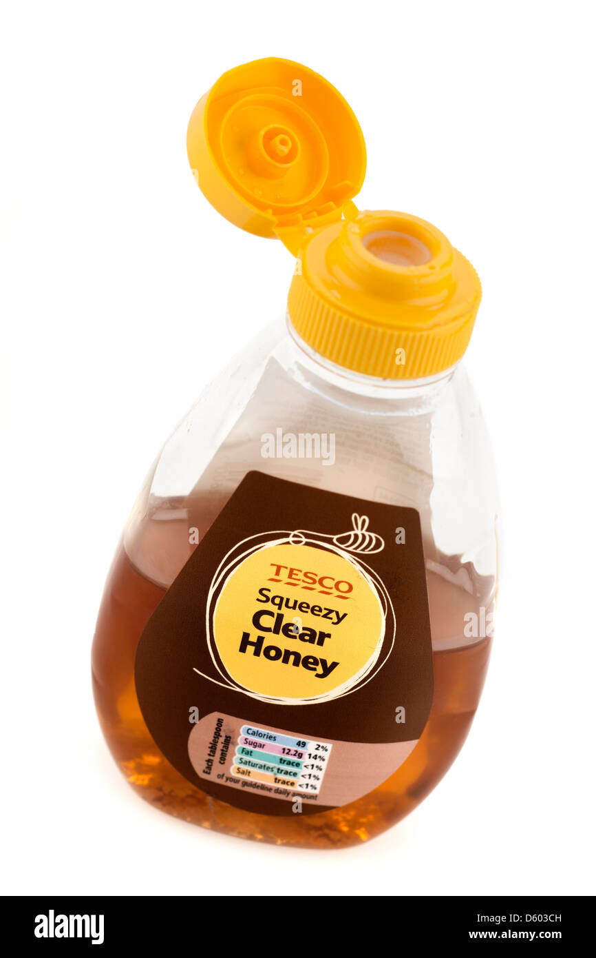 Halb verwendeten Tesco Kunststoff squeezy klarer Honig Flip Top-container Stockfoto