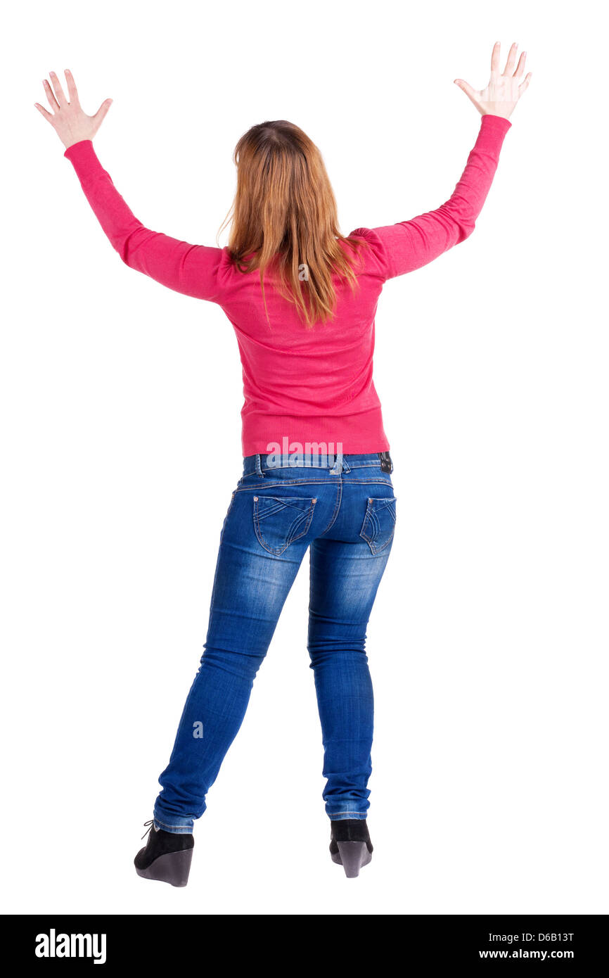 Rückansicht des schönen Brünette Frau in Jeans. Vorführung von positiven Emotionen. Hintere Ansicht Menschen Sammlung. Ansicht der Rückseite. Stockfoto